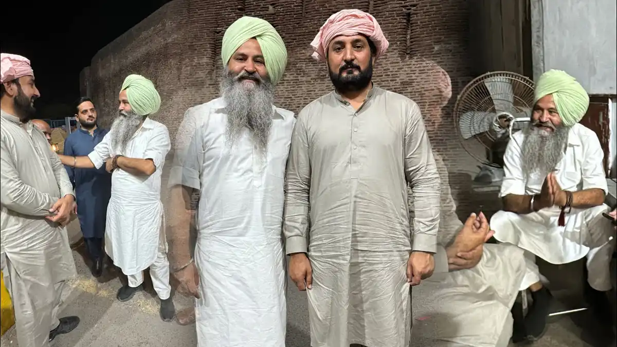 Anjum Saroya at his ancestral pind (village) ghar, with Punjabi mitti di khushboo in the background.