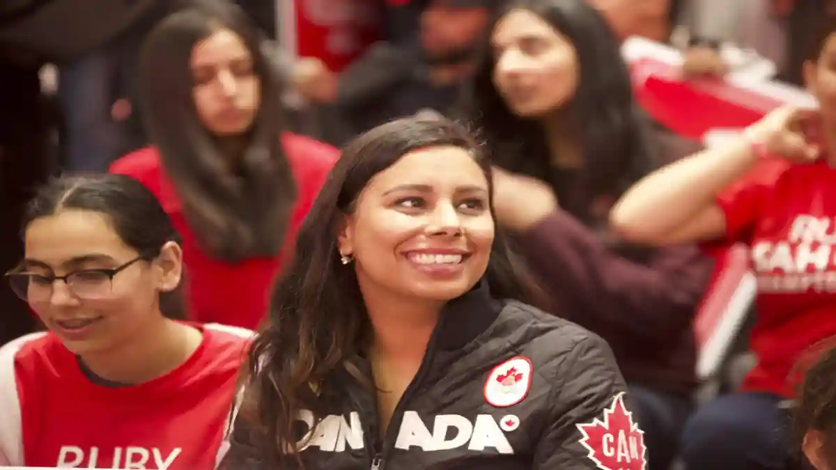 Ruby Sahota with Trudeau addressing a public gathering.